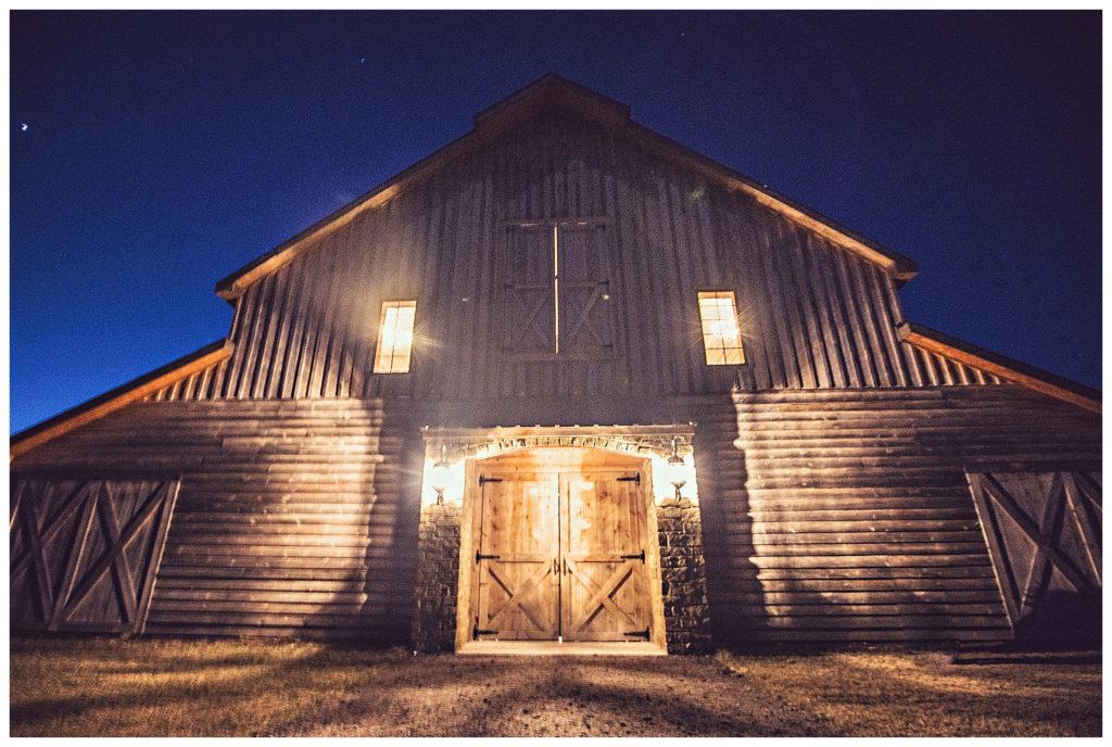 Stone Hill barn lit up at night