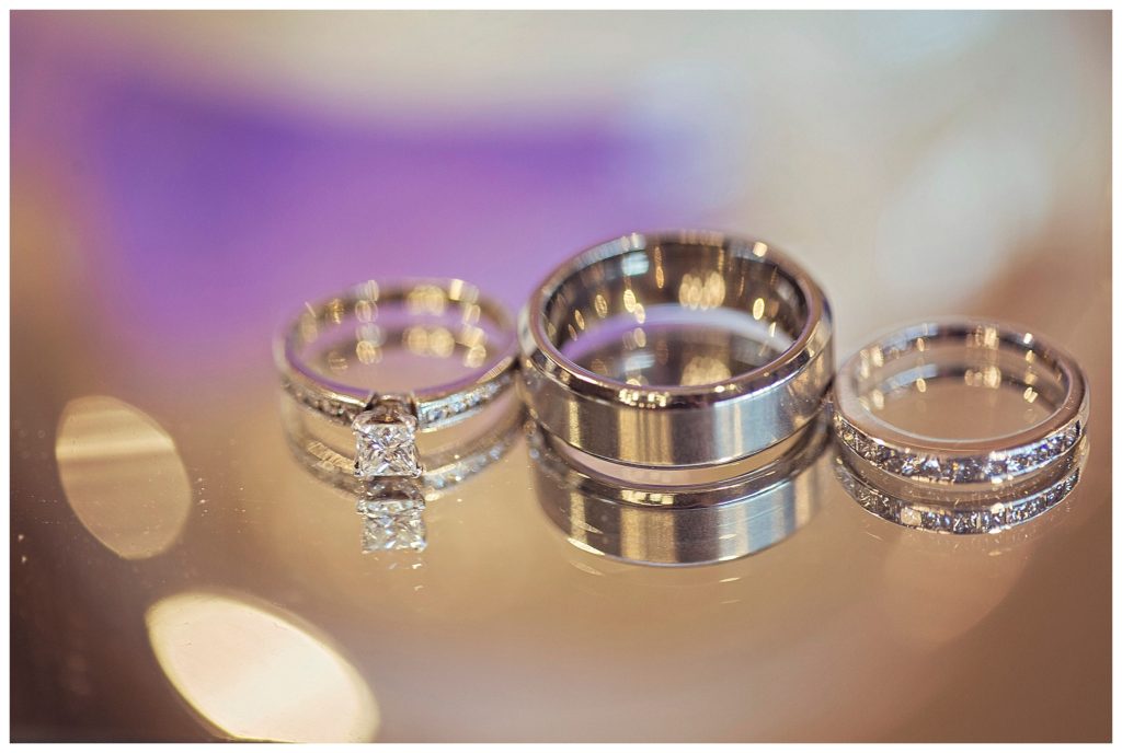 detail image of wedding rings on mirror