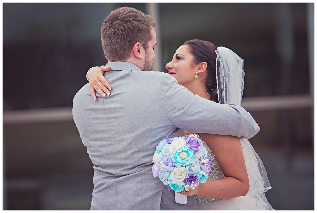 bride and groom hugging