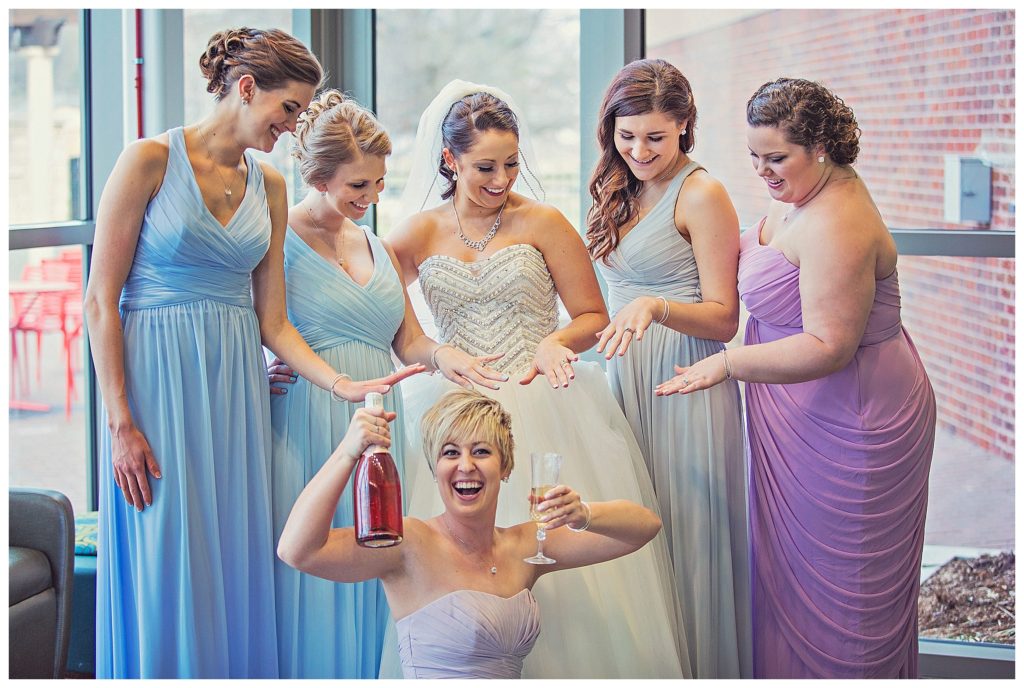 The bridesmaids checking out their rings