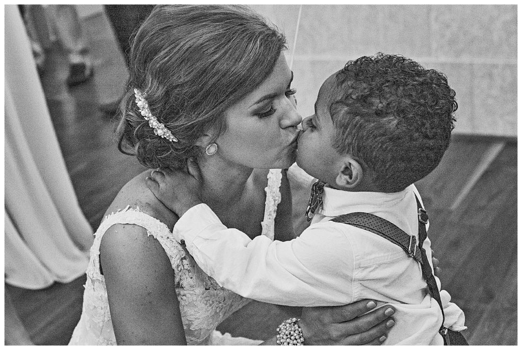 bride kissing the ring bearer