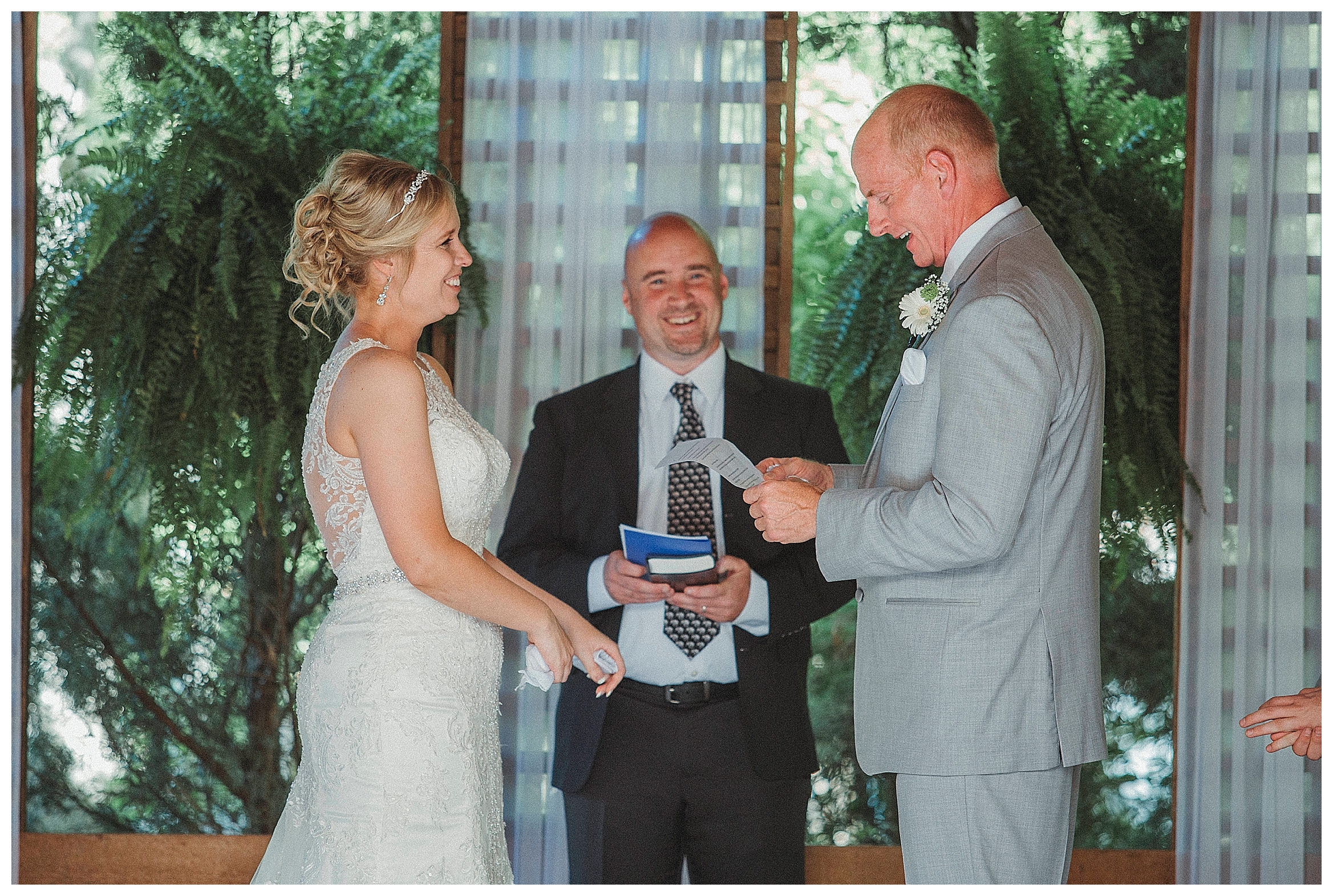 groom reading his vows to the bride