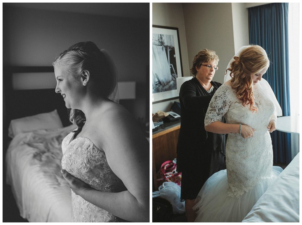 mom helping the bride in her dress