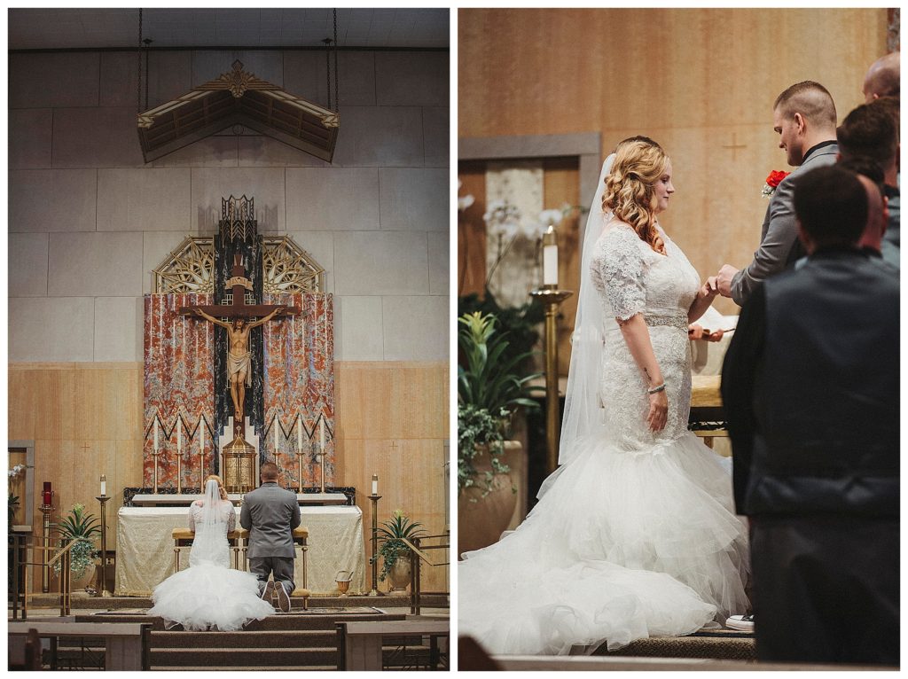 bride and groom kneeling at the alter