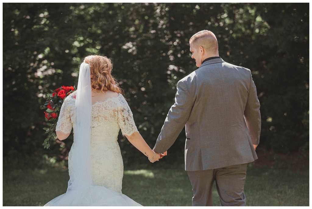 bride and groom walking away from the camera