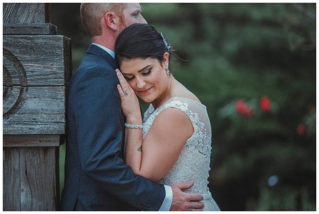 bride leaning on her groom