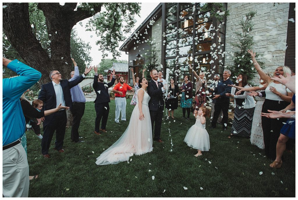 everyone celebrating around the bride and groom