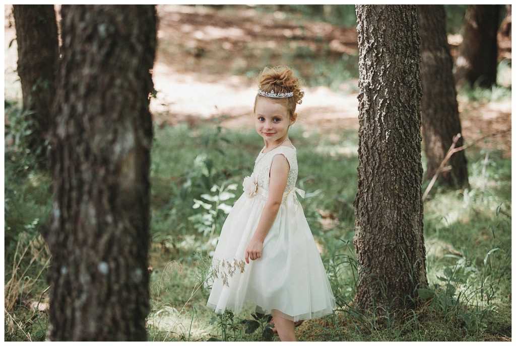 flower girl playing in the trees