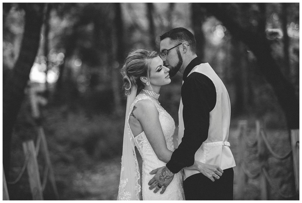 bride and groom on bridge