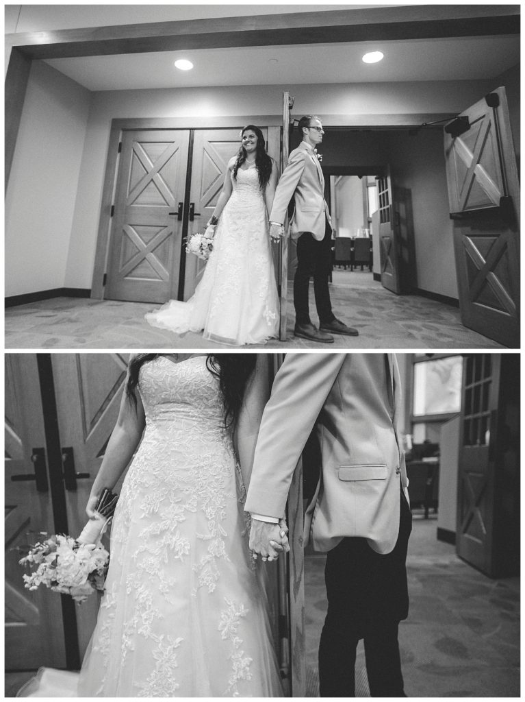 Bride and groom holding hands behind door