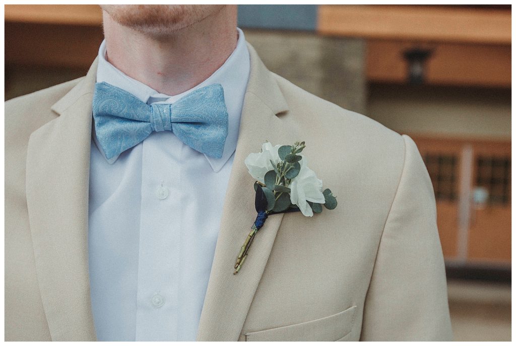 grooms bow tie and flowers