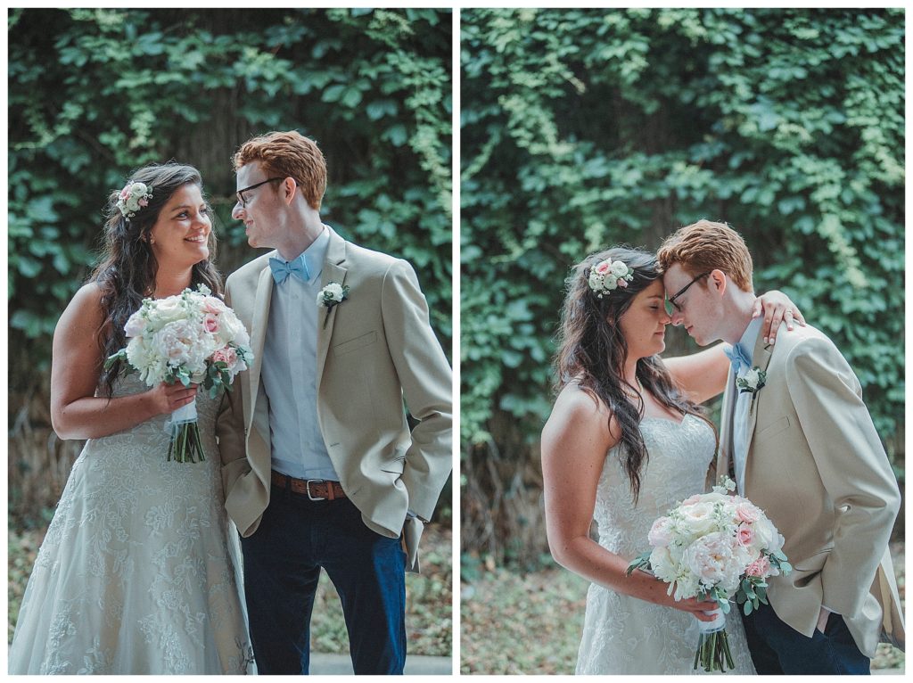 bride and groom in front of green vines