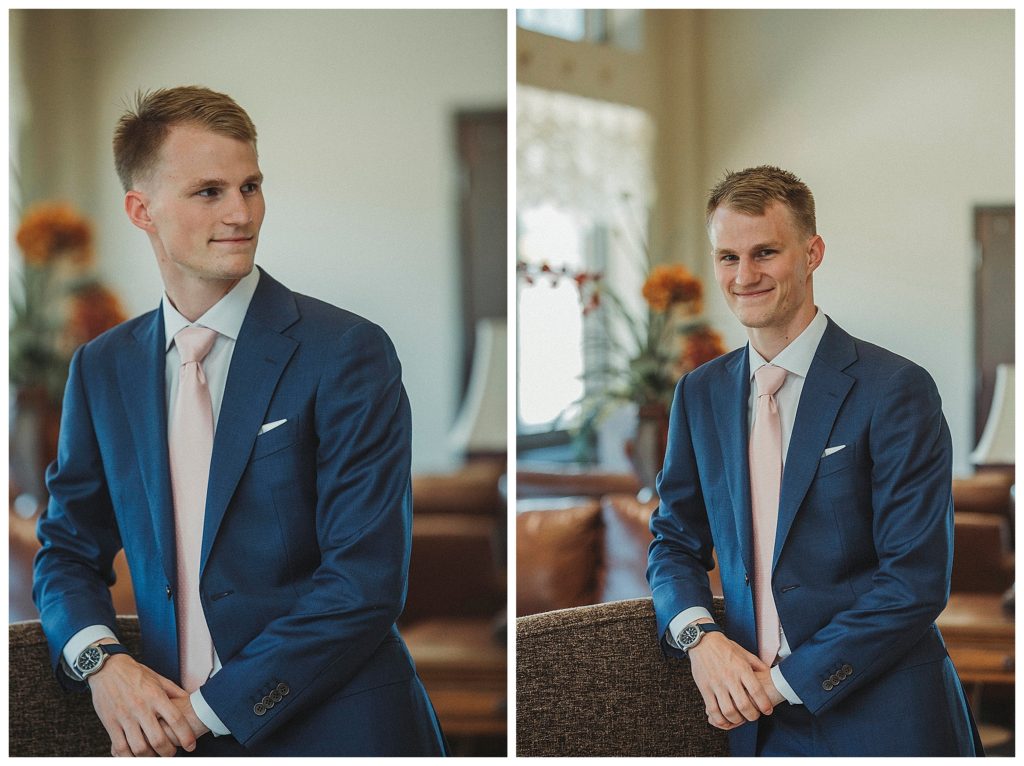 groom posing in hotel lobby