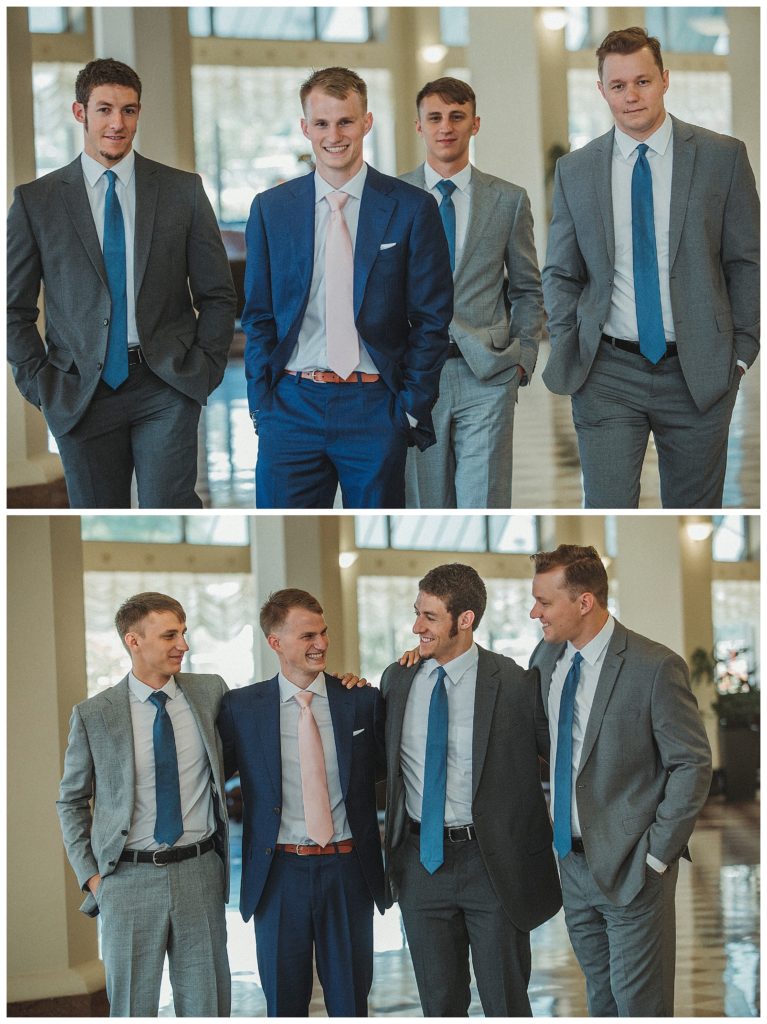 groom with groomsmen posing in hotel lobby