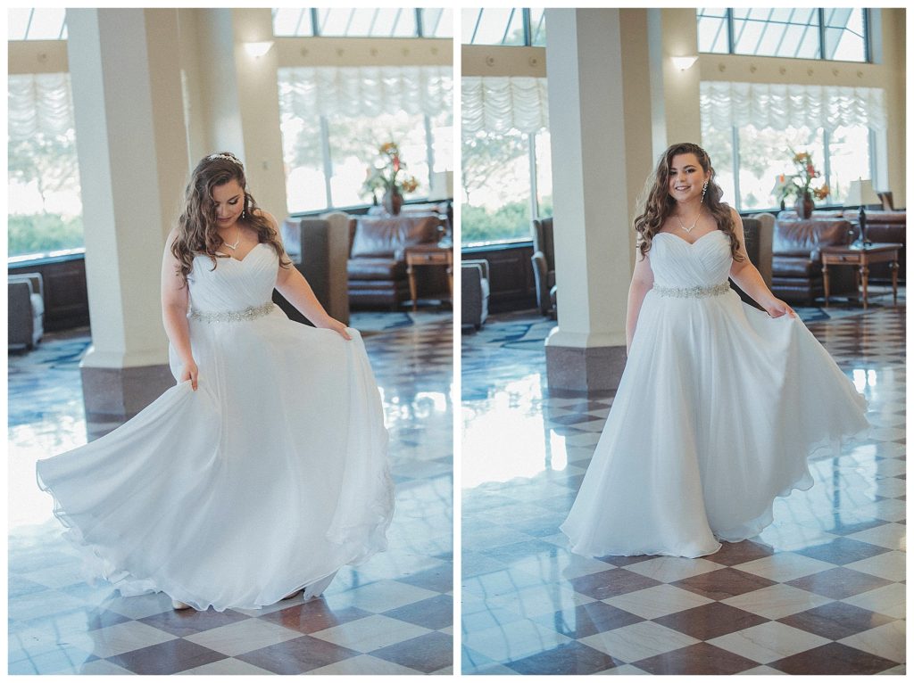 bride swinging her dress in hotel lobby