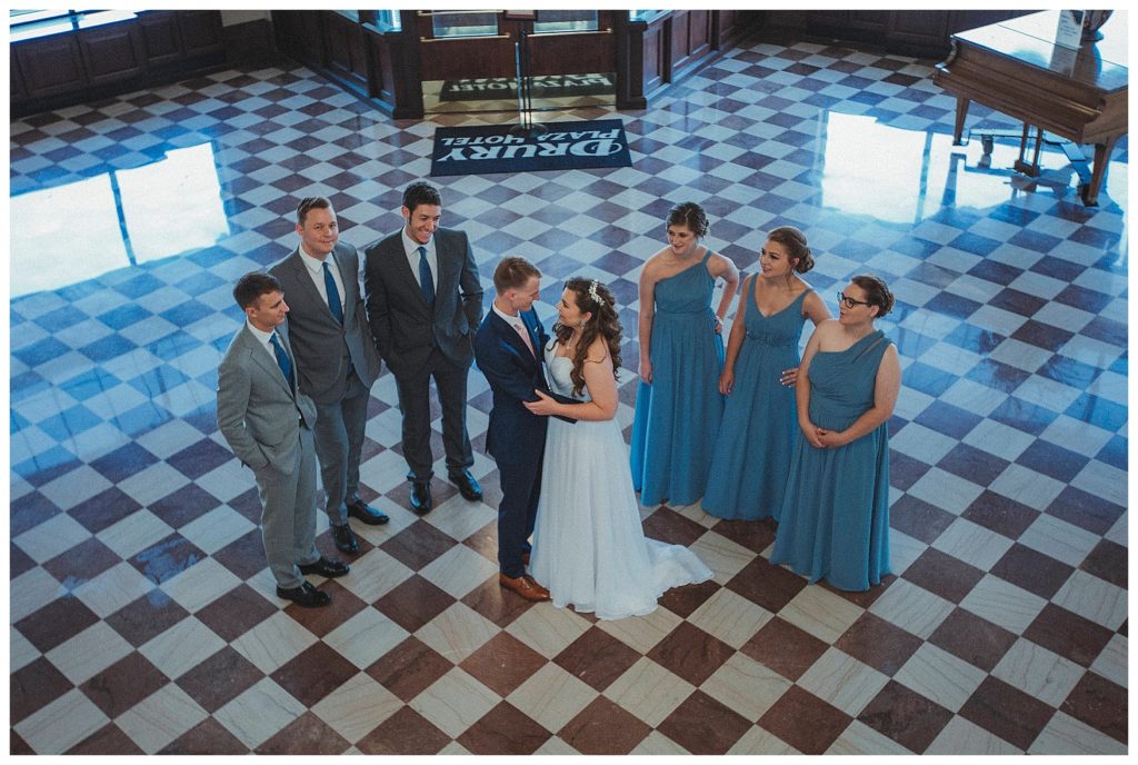 bridal party posing in hotel lobby