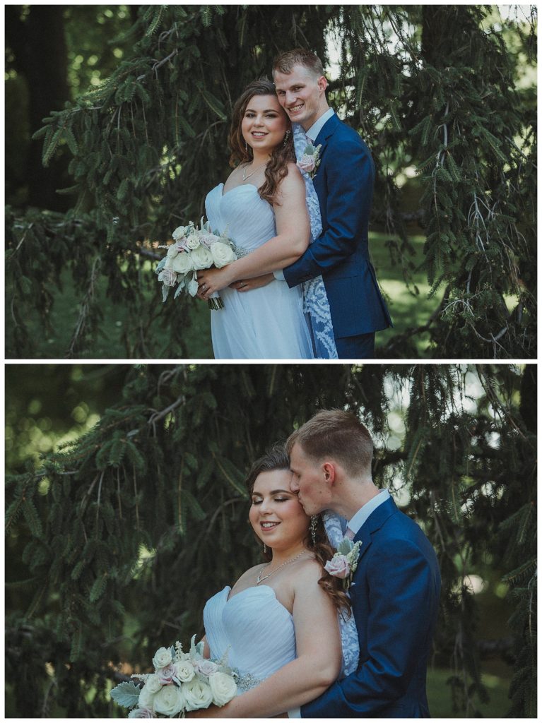 groom hugging his bride from behind