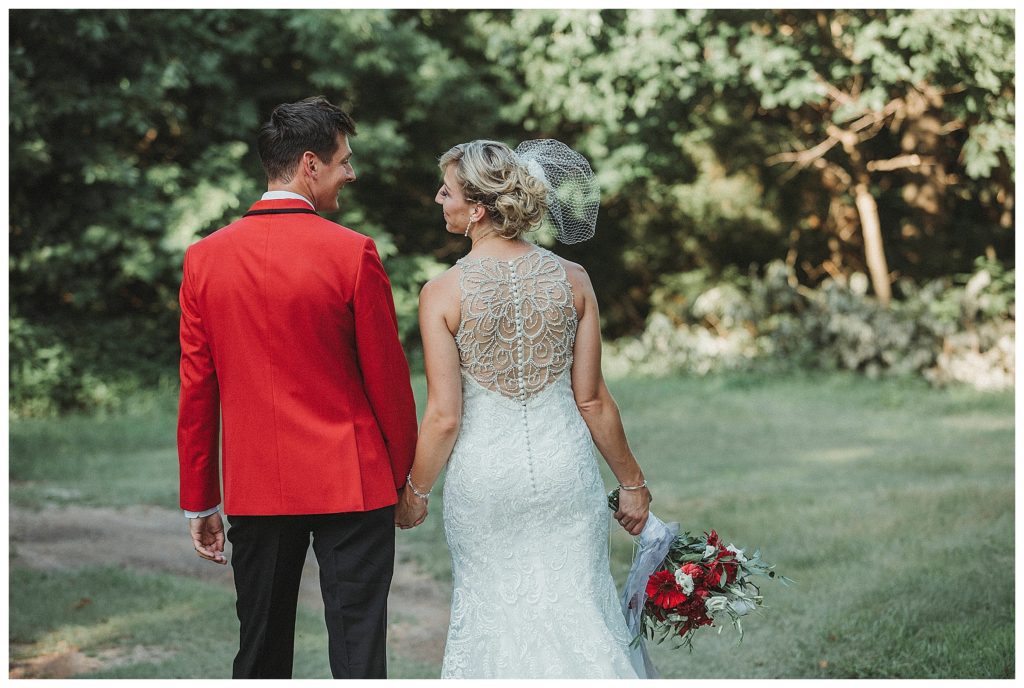 bride and groom walking away from camera