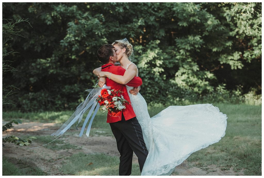 groom swinging the bride around