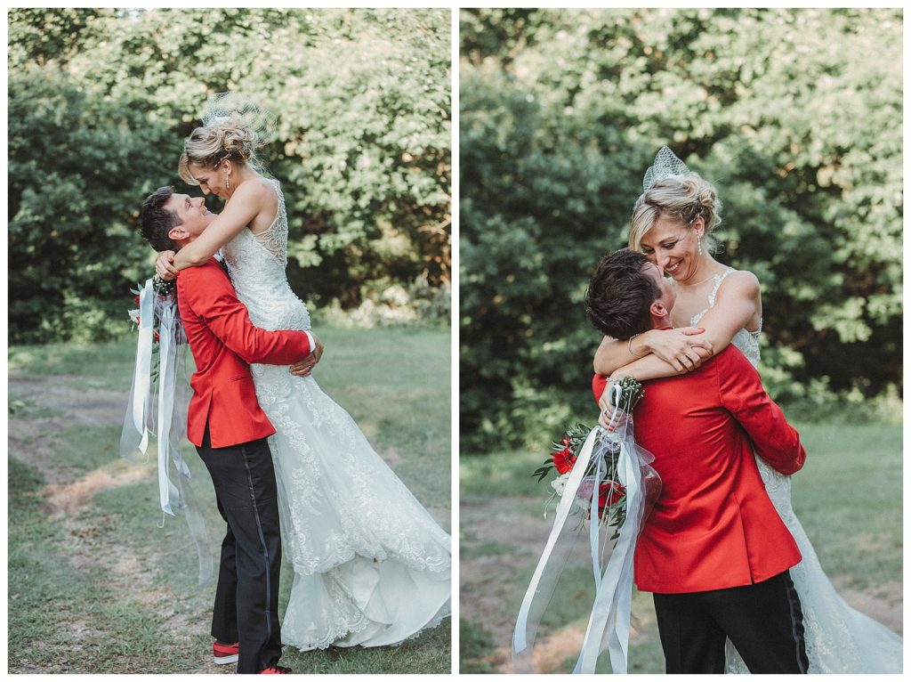 groom holding up his bride