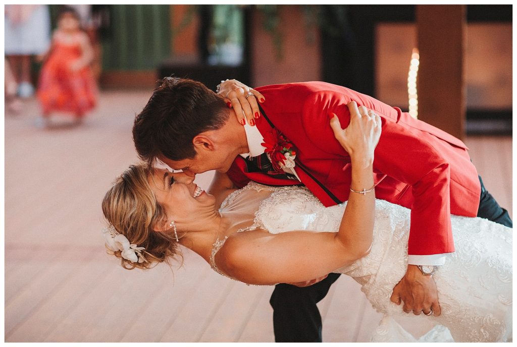 groom dipping his bride