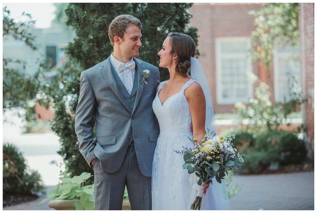 bride and groom in courtyard