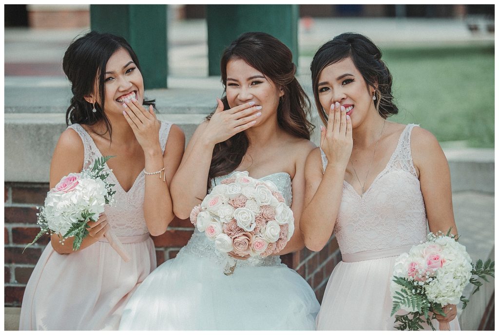 bride laughing with her bridesmaids