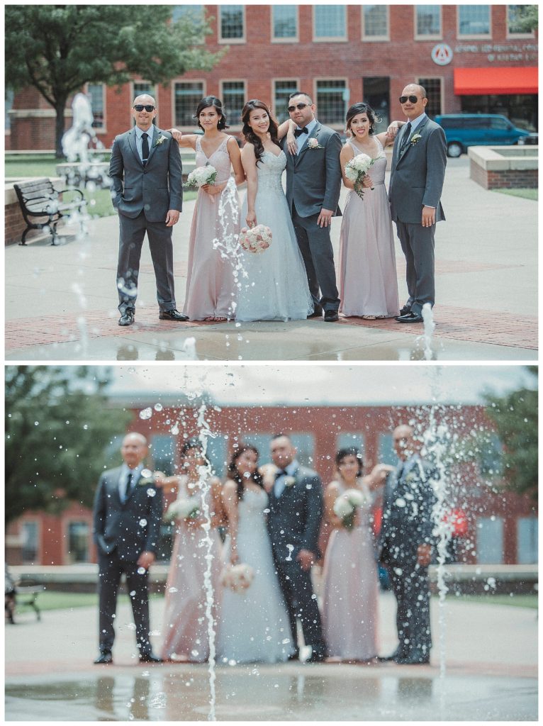 bridal party posing by splash pad