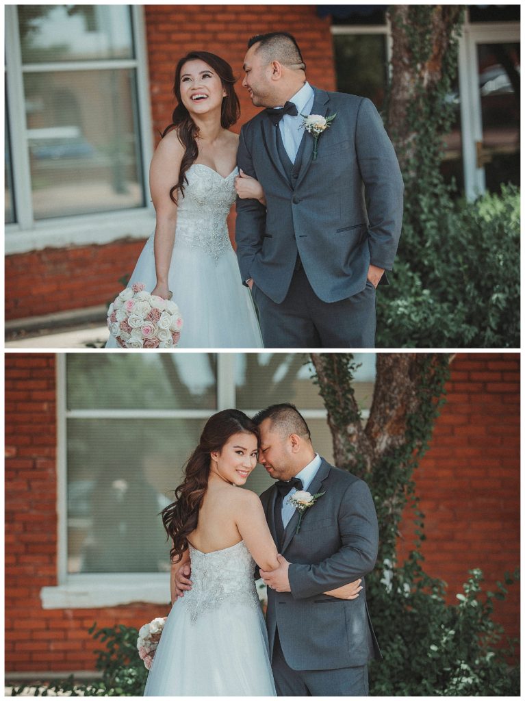bride and groom posing down town