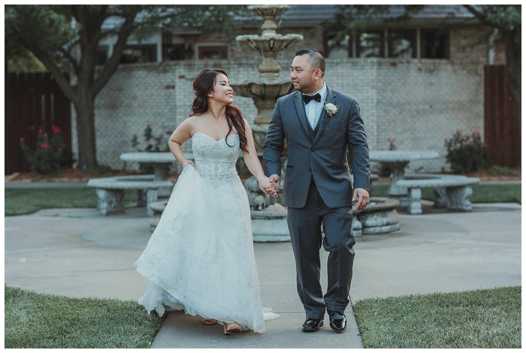 couple walking in a courtyard