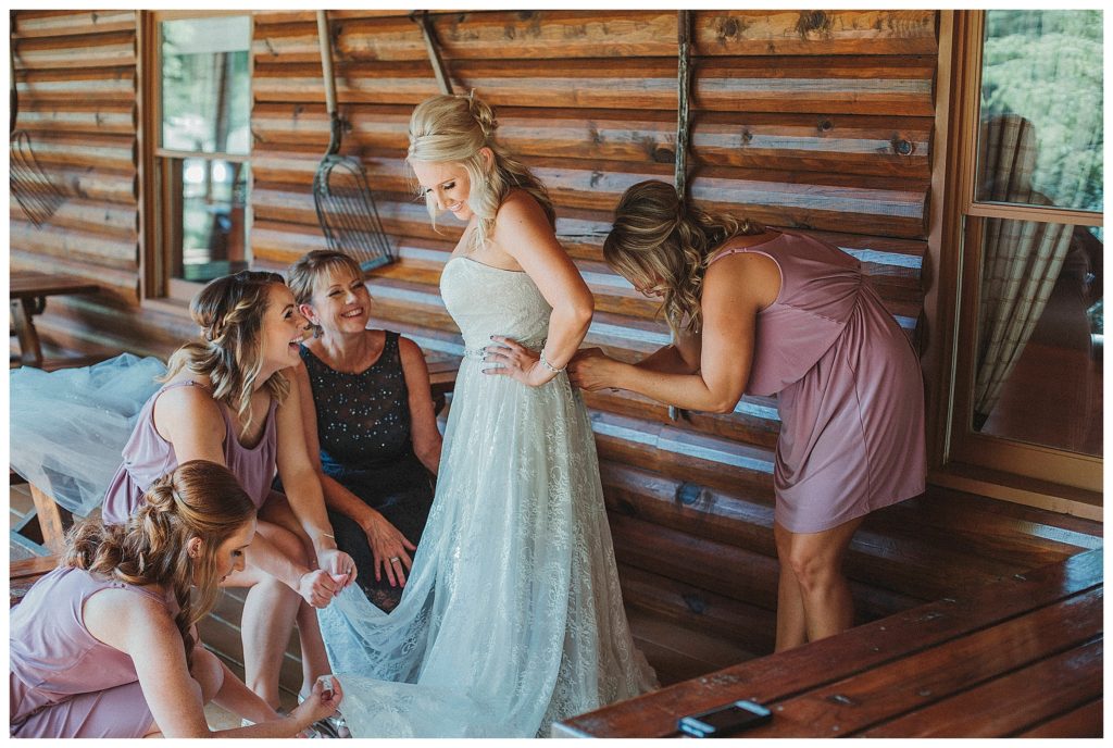bride getting dressed outdoors