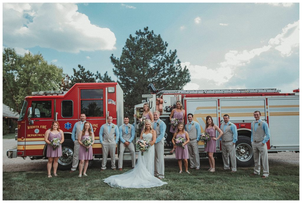 bridal party in front of fire engine