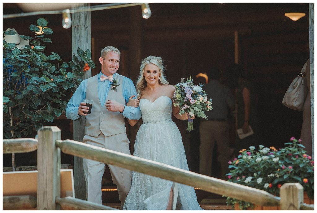 bride and groom entering their reception