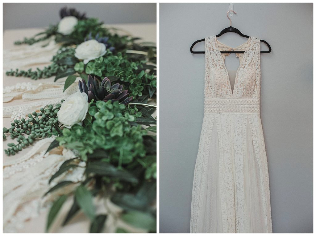 brides dress hanging on wall