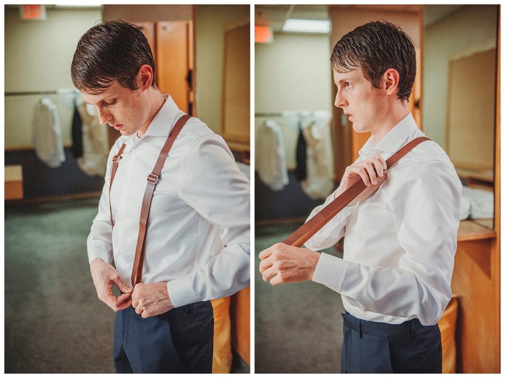 groom putting on suspenders