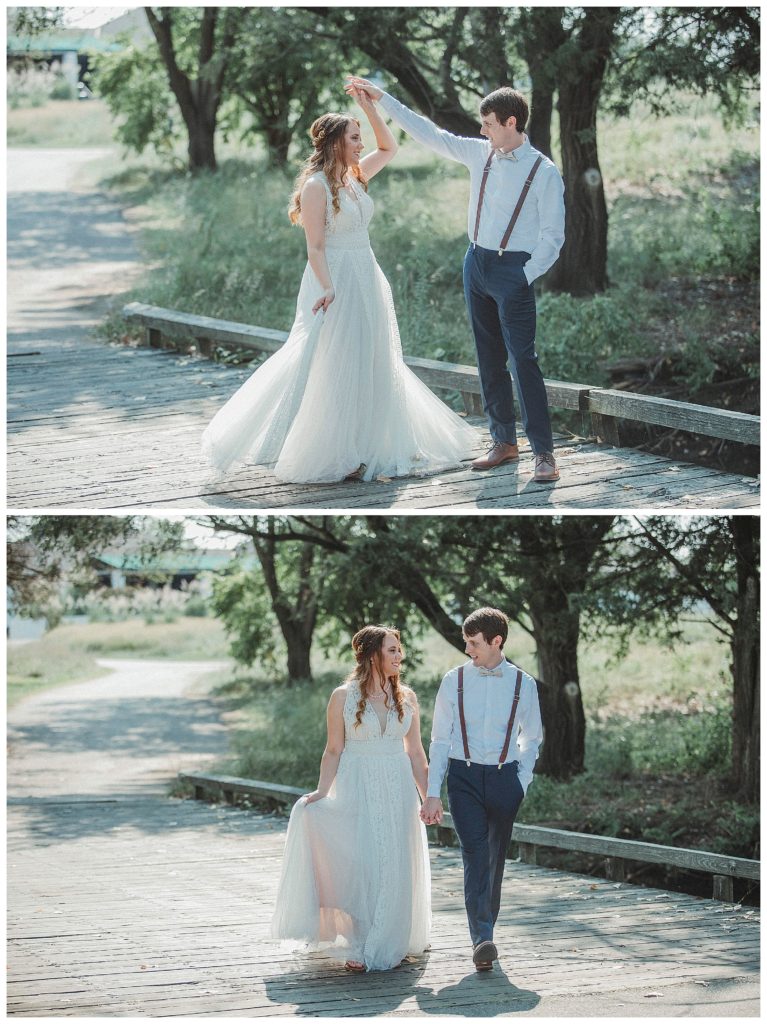 bride and groom dancing on bridge