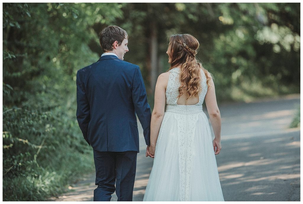 groom and bride walking away