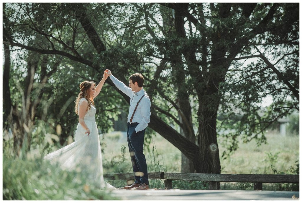 groom twirling the bride