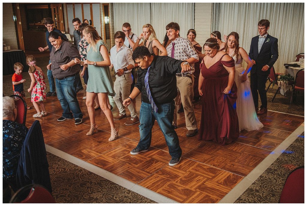 wedding guests dancing at the reception