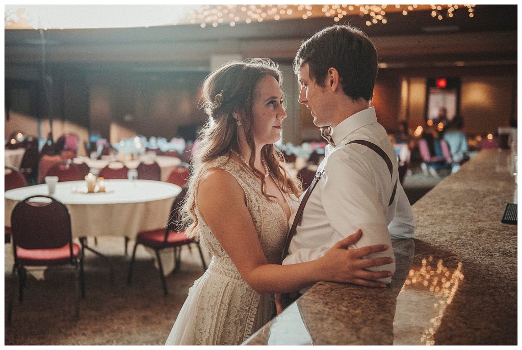 bride and groom mingling at the bar