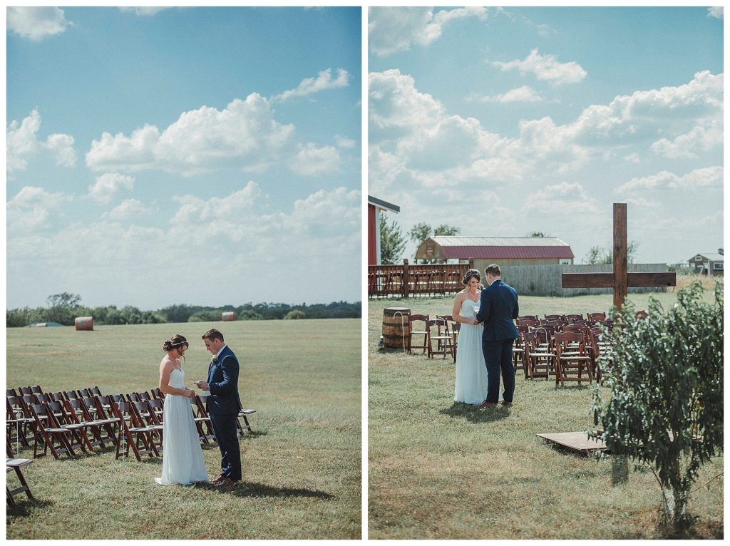 bride and groom reading vows to eachother