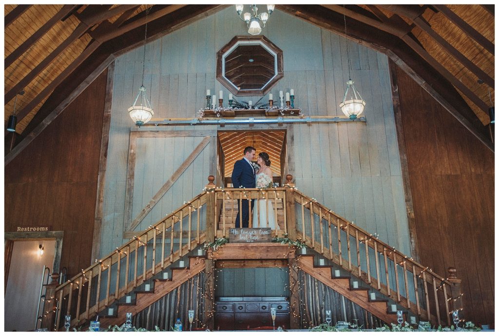 bride and groom at the top of stairs
