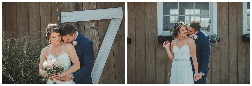 bride and groom in front of barn