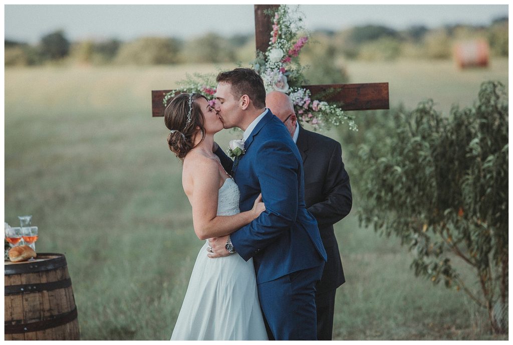 groom kissing his bride
