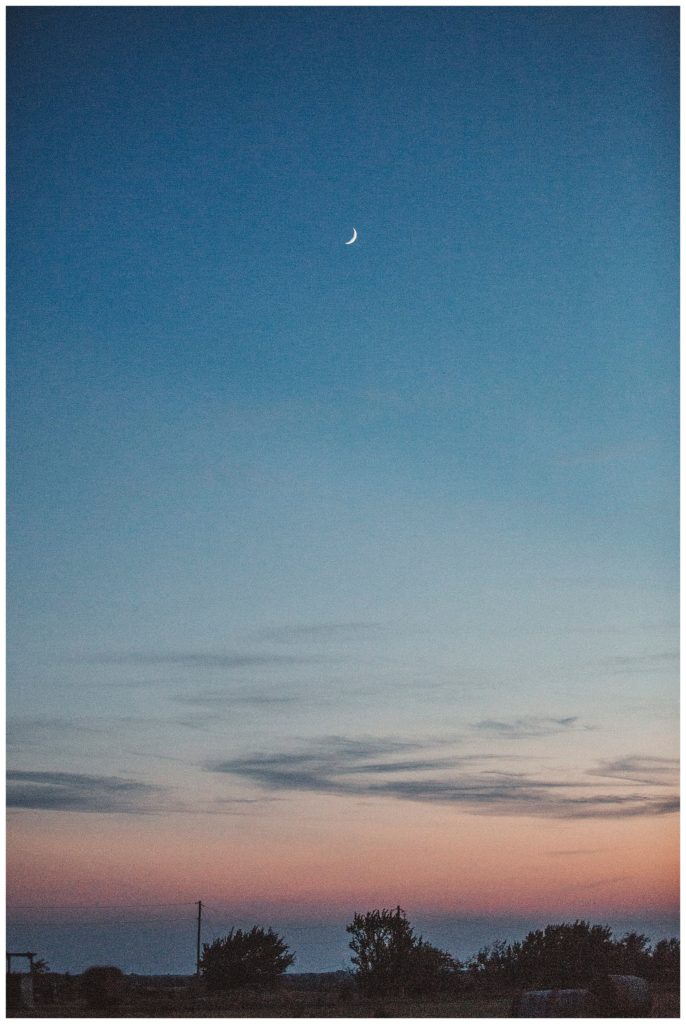 landscape on farm with moon shinning above