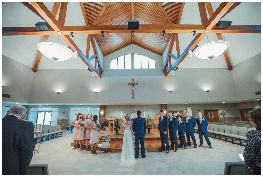 bridal party at the alter