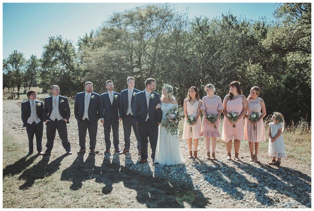 the bridal party posing on the farm