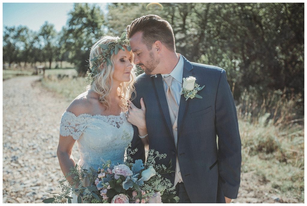 bride and groom holding eachother