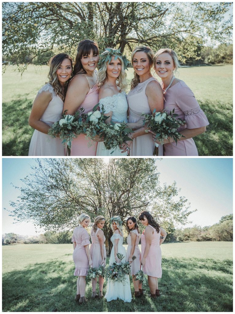 bride and her bridesmaids in front of a large tree