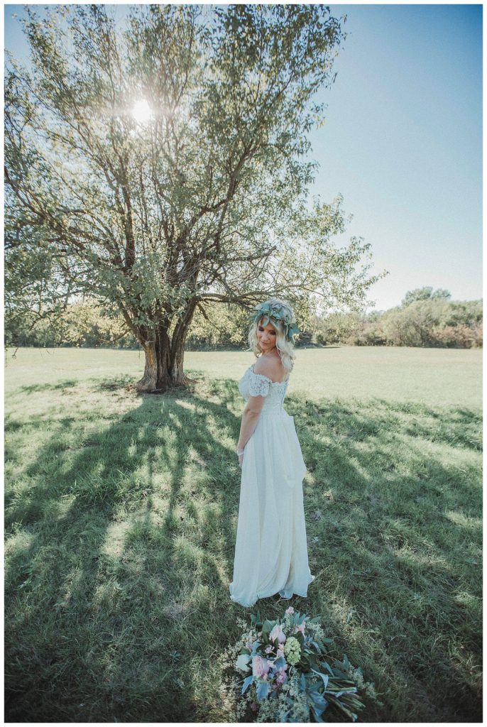 bride in front of large tree